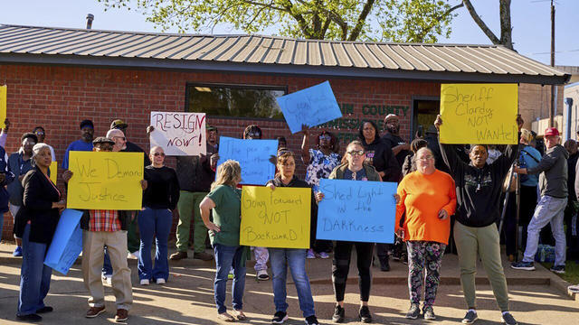 In this photo provided by the Southwest Ledger, McCurtain County residents call for the resignation of several McCurtain County officials after tapes with the officials' racist comments surfaced over the weekend, in Idabel, Okla., Monday, April 17, 2023. 