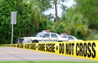 Crime scene investigation w sheriff cars and barrier tape 