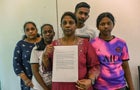 Leelavathy Suppiah (center), sister of a convicted drug trafficker Tangaraju Suppiah, who is scheduled for execution, poses with family members as she holds a petition letter to seek clemency in Singapore on April 23, 2023. 