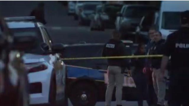 Police vehicles with overhead strobe lights at a crime scene 