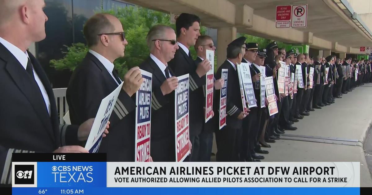 American Airlines pilots picket at DFW after voting to authorize strike