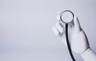 robotic hand holding stethoscope (concepts of AI medical care) 