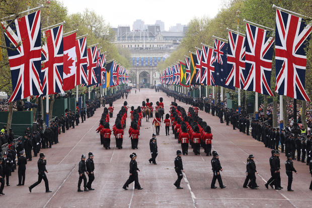 Coldstream Guards and London Metropolitan Police march in the procession ahead of the Coronation of King Charles III  