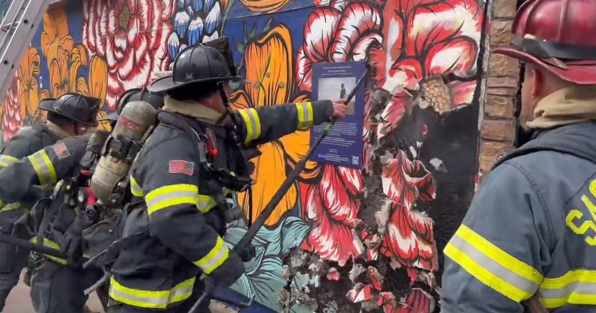 VIDEO: Crews rip through part of mural to battle fire at Sacramento nail salon