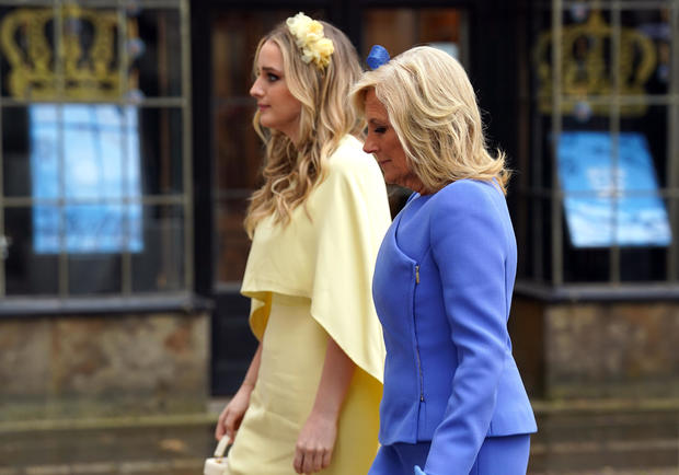U.S. first lady Jill Biden and her granddaughter Finnegan Biden arrive at Westminster Abbey for the coronation ceremony.  