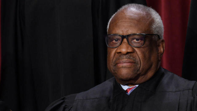 Supreme Court Justice Clarence Thomas poses for the official photo at the Supreme Court in Washington on Oct. 7, 2022. 