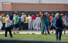 Young people stop to get something to drink on the grounds of the Homestead Temporary Shelter for Unaccompanied Children as members of Congress visit the facility during an oversight tour on July 15, 2019, in Homestead, Florida. 