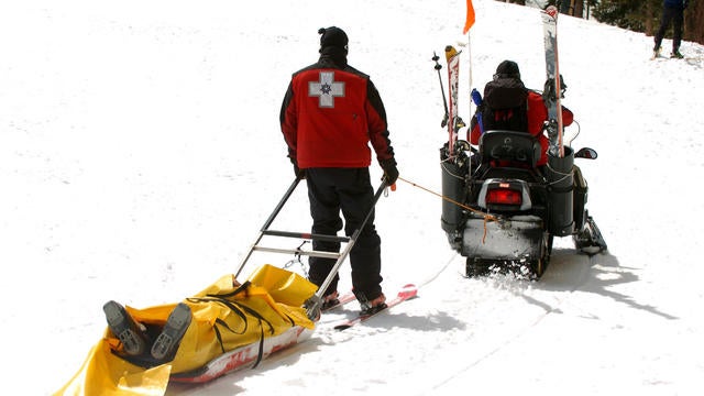 (HR) ABOVE: Members of the Keystone Ski Patrol take a skier off the mountain after she got hurt. This year has been the highest year of skier deaths in the mountains. Four of them alone at Keystone Resort. There seems to be no trend to the deaths with age 