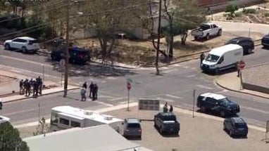 Crews work the scene of a deadly mass shooting in Farmington, New Mexico, May 15, 2023, in an image capture from aerial footage. 