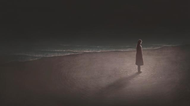 Woman alone with night sea 