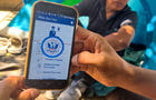 A migrant shows the CBP One App from Customs and Border Protection, which is used to apply for an appointment to claim asylum, in Ciudad Juárez, Mexico, on May 10, 2023. 
