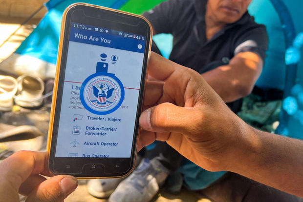 A migrant shows the CBP One App from Customs and Border Protection, which is used to apply for an appointment to claim asylum, in Ciudad Juárez, Mexico, on May 10, 2023. 