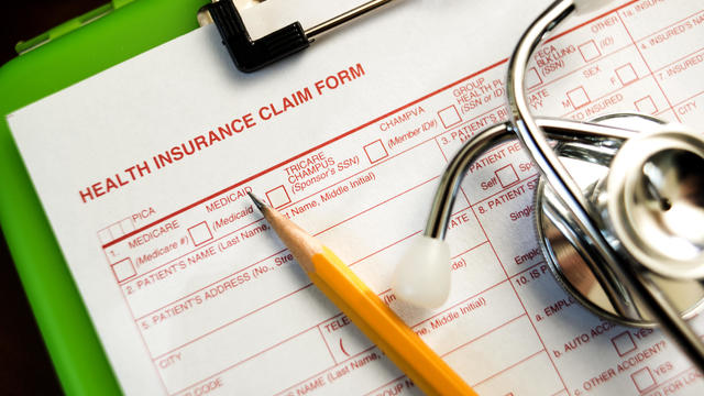 Health insurance claim form with pencil 