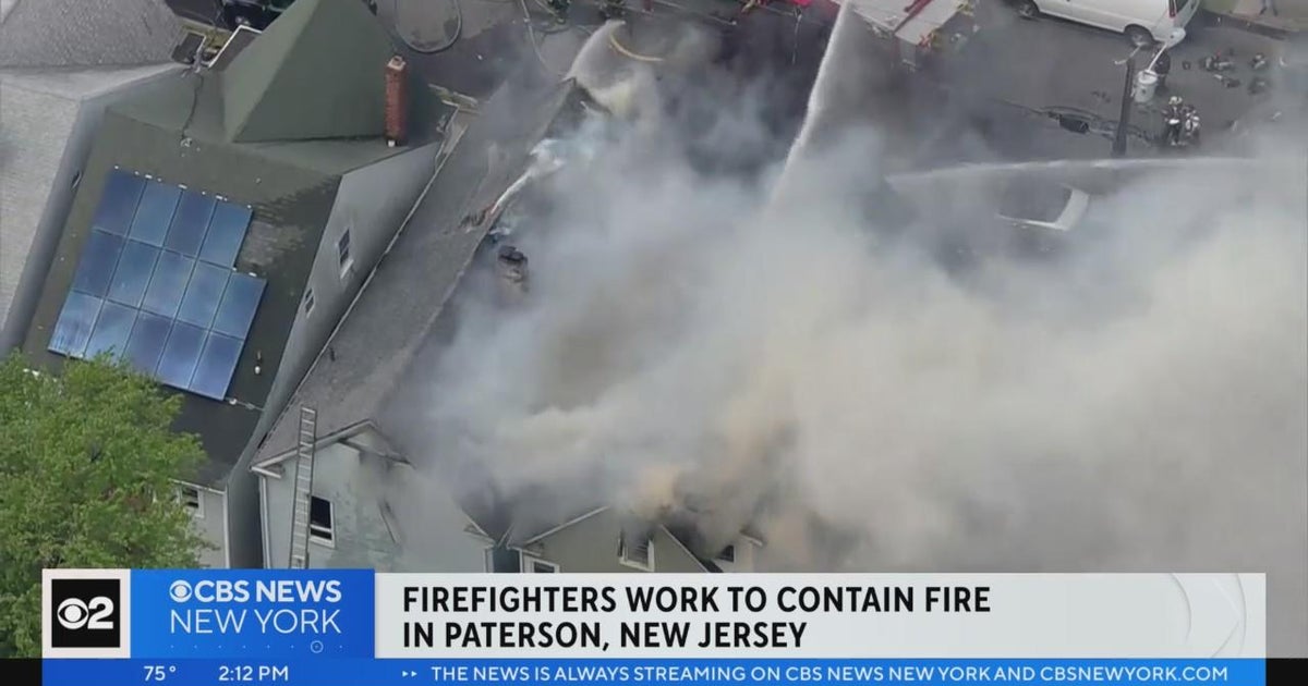 Firefighters work to contain fire in Paterson, N.J. - CBS New York