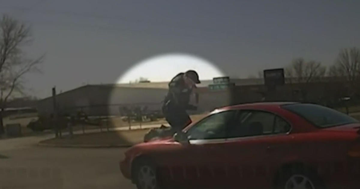 Video shows officer clinging to car during Iowa chase
