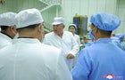 North Korean leader Kim Jong Un and his daughter Kim Ju Ae meet with members of the Non-permanent Satellite Launch Preparatory Committee in Pyongyang, North Korea May 16, 2023, in this image released by North Korea's Korean Central News Agency on May 17, 2023. 