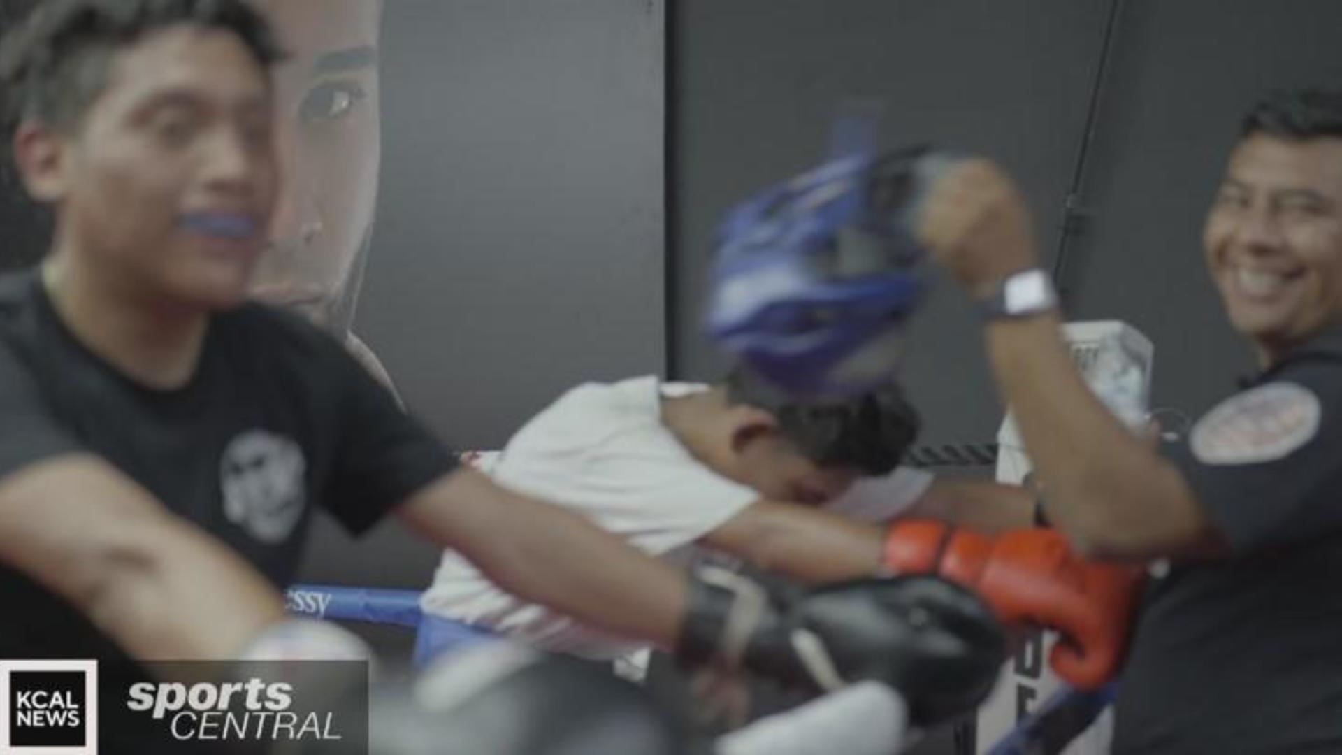 Local boxing brothers leaning on dad for training inspiration