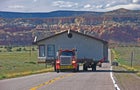 Wide-Load Truck Moving a House 