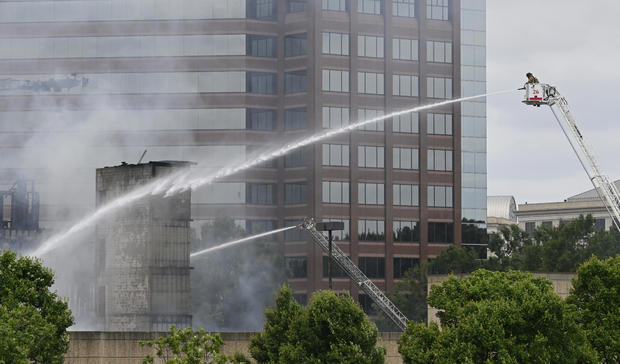 Firefighters spray water at the scene of a massive fire in Charlotte, North Carolina 