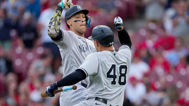 Aaron Judge #99 of the New York Yankees and teammate Anthony Rizzo #48 celebrate after Judge hit a home run in the first inning against the Cincinnati Reds at Great American Ball Park on May 19, 2023 in Cincinnati, Ohio. 