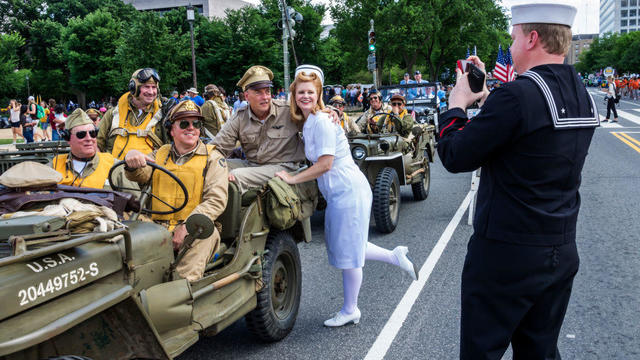Washington DC, National Memorial Day Parade, float, Jeep, V-J Day, The Kiss, nurse, sailor, reenactors, posing for photo, 