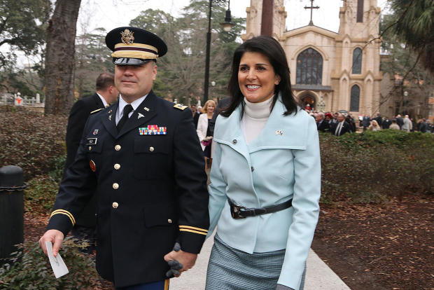 Governor Nikki Haley, joined by her family Michael, Rena and  Nalin, cross Sumter Street on their way to the State House after the Inaugural Prayer service held at Trinity Episcopal Cathedral, Wednesday morning. 