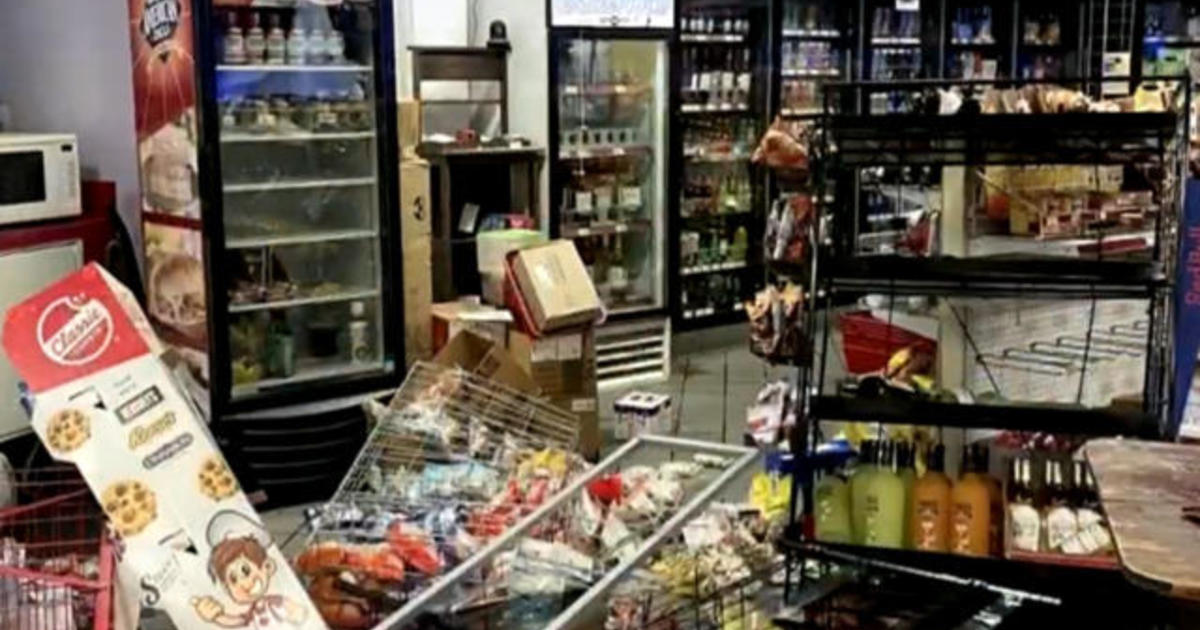 Suspect shot after allegedly pulling gun on store owner inside