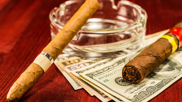 Two cuban cigars with glass ashtray 