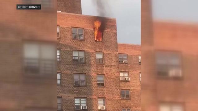 Flames could be seen shooting out of an apartment window after a high-rise fire in East Harlem on June 2, 2023. 