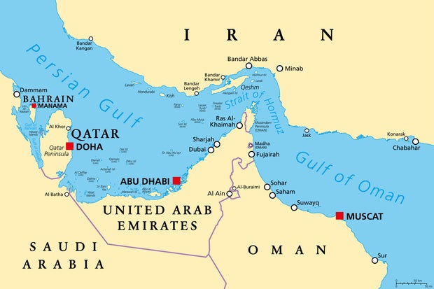 A map shows the Strait of Hormuz, a crucial waterway between the Persian Gulf and the Gulf of Oman, with Iran to the north and the UAE and Oman exclave Musandam to the south