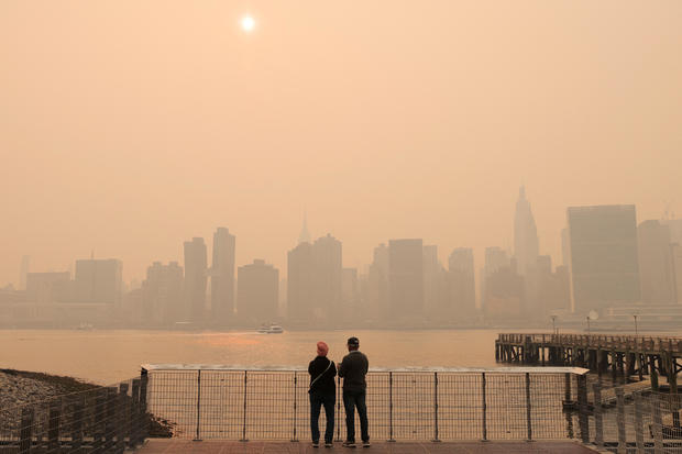 Haze and smoke caused by wildfires in Canada hang over the Manhattan skyline, in New York City 