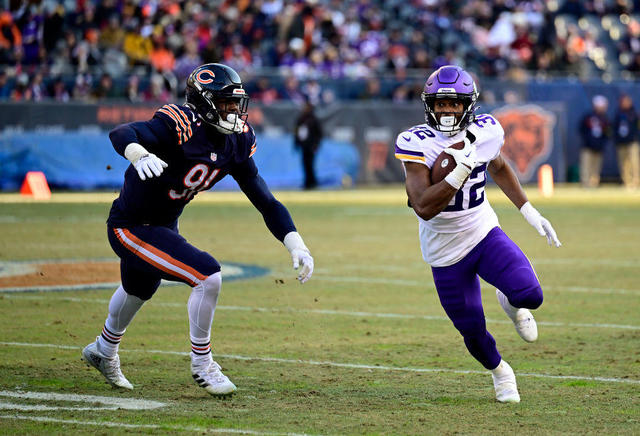 Ty Chandler of the Minnesota Vikings carries the ball against the News  Photo - Getty Images