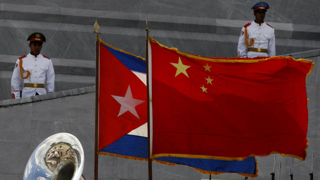 Cuban and China flags wave at the Jose Marti monument during a ceremony for China's President Hu Jintao, unseen, in Havana, Tuesday, Nov. 18, 2008. 