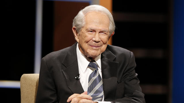 The Rev. Pat Robertson poses a question to a Republican presidential candidate during a forum at Regent University in Virginia Beach, Va., Oct. 23, 2015. 