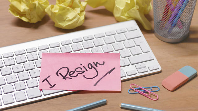 i resign message on abandoned office desk 