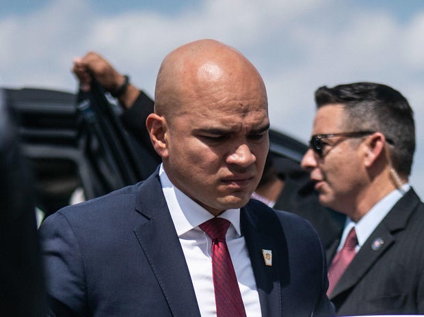 Walt Nauta, an aide to former President Donald Trump, follows Trump as they board his airplane, known as Trump Force One, en route to Iowa at Palm Beach International Airport on March 13, 2023, in West Palm Beach, Florida.
