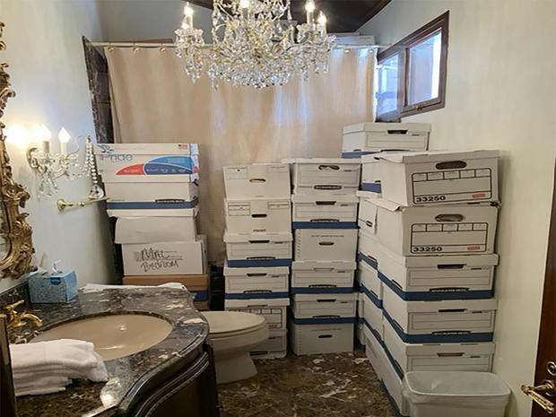 Stacks of boxes can be observed in a bathroom and shower at former President Donald Trump's Mar-a-Lago estate in Palm Beach, Florida. 
