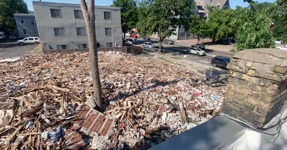 Rubble pile of burned Uptown apartment causing problems six months after fire, neighbors say