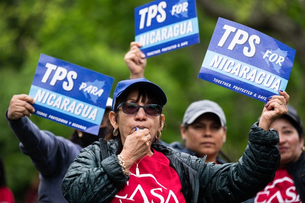 Demonstrators rally in Lafayette Park to demand Temporary Protected Status for Nicaragua, Honduras, Guatemala, and El Salvador on Monday, May 1, 2023.