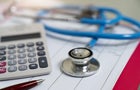 Cost of health care concept, stethoscope and calculator 