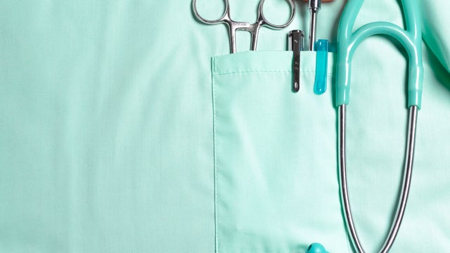 Doctors pockets with medical instruments.