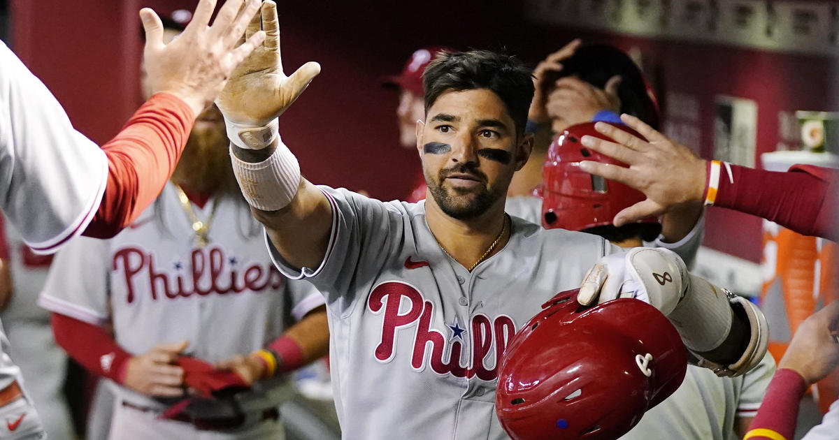 Nick Castellanos of the Philadelphia Phillies high fives teammates