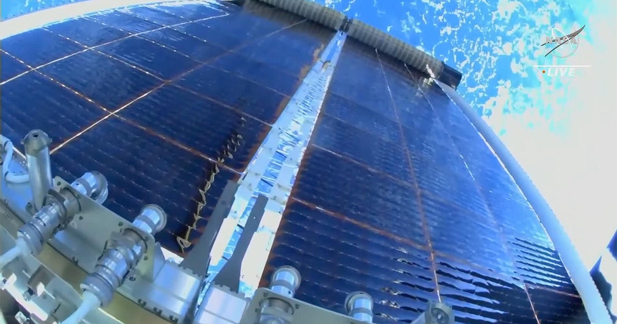 Spacewalkers install sixth supplemental solar array in space station power upgrade Spacewalkers install sixth supplemental solar array in space station power upgrade