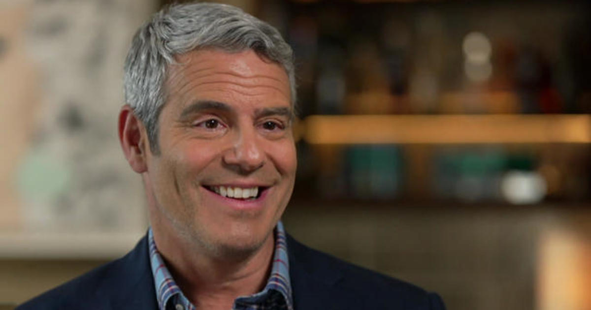 Here Comes the Sun: Talk show host Andy Cohen and shoes on or off?