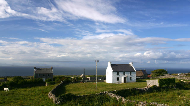 Neat whitewashed Irish cottage on the island of Inishee 