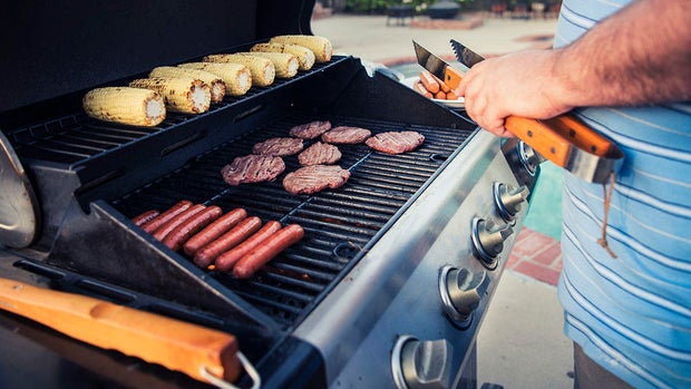 Close up of man grilling