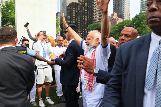 India leader Modi uses yoga to unite at U.N. ahead of Biden meeting, but many see him as a divider