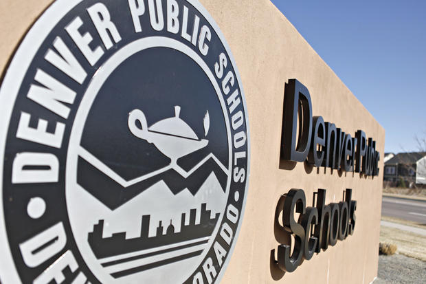 A Denver Public Schools emblem and sign 