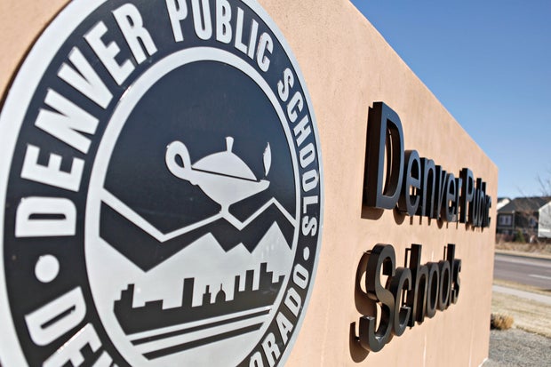 A Denver Public Schools emblem and sign