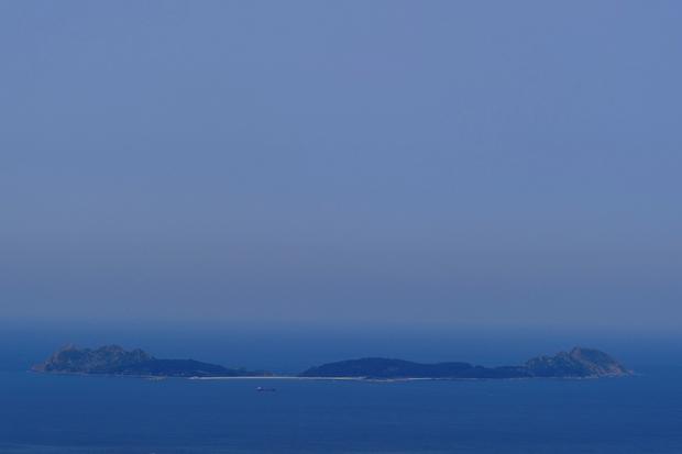 The smoke cloud produced by the multiple wildfires in Quebec is seen over the Cies Islands next to the coast of Vigo, northwestern Spain, on June 26, 2023. 